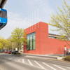 The International Meeting Center on Campus North. The H-Bahn is driving past.