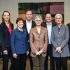 The picture shows eight people posing for a group photo.